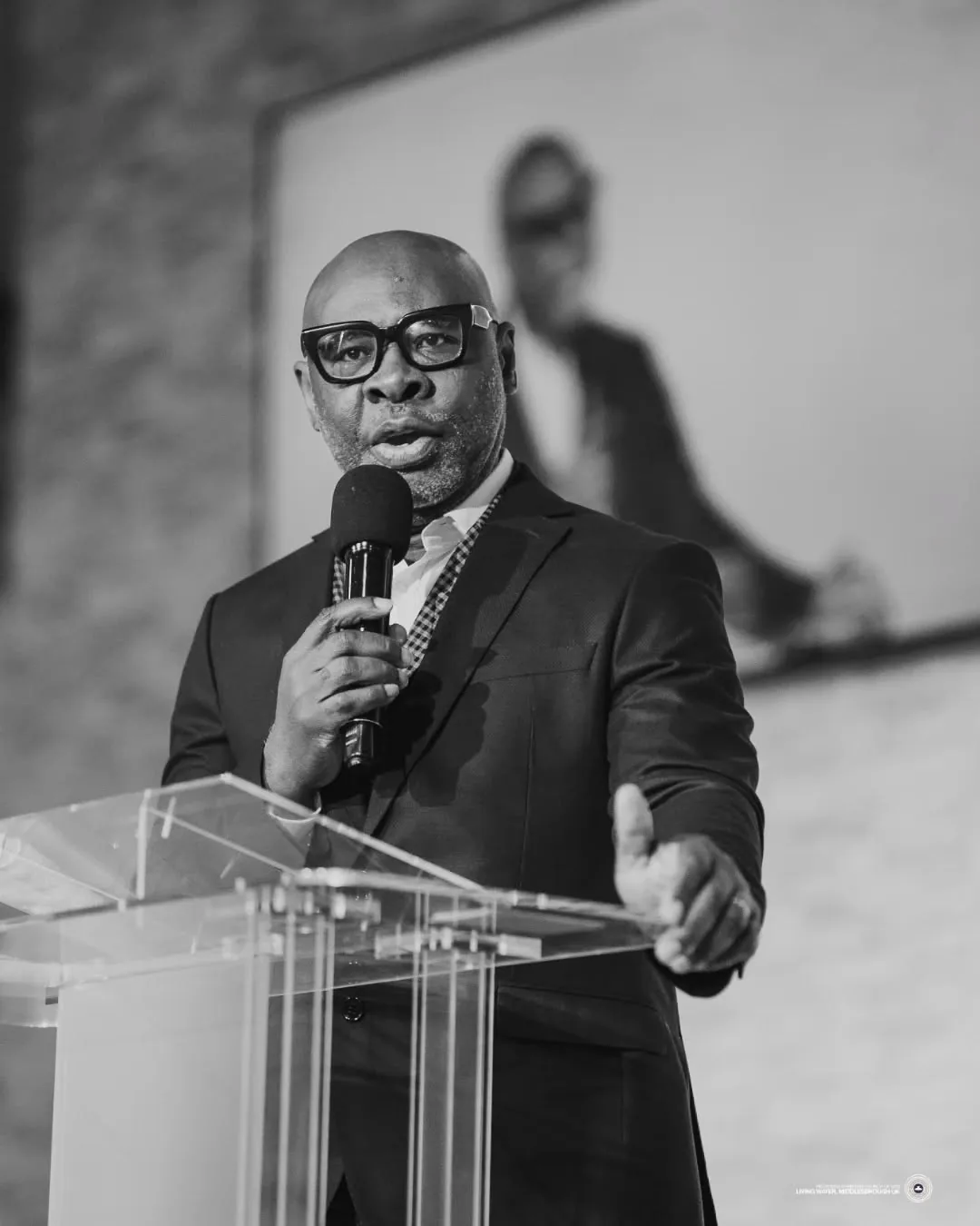 Pastor preaching during a Living Water service
