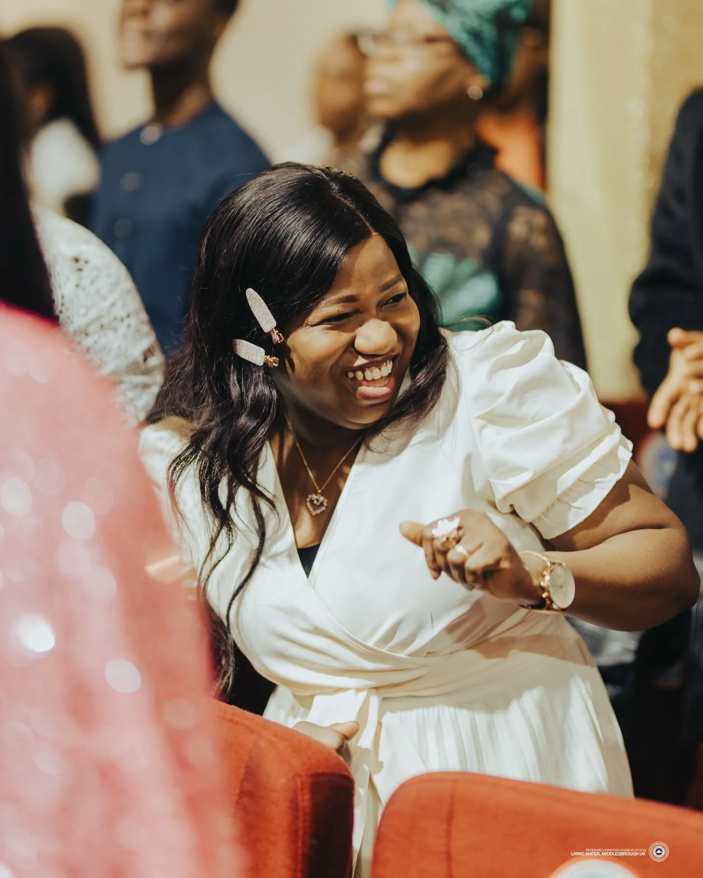 A joyful worshipper during a Living Water church gathering